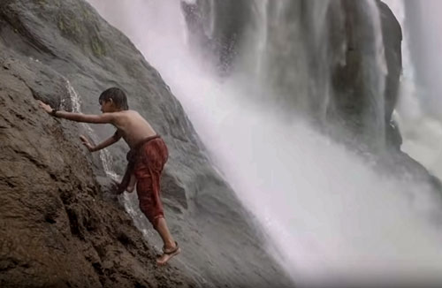 Shivudu climbs waterfall